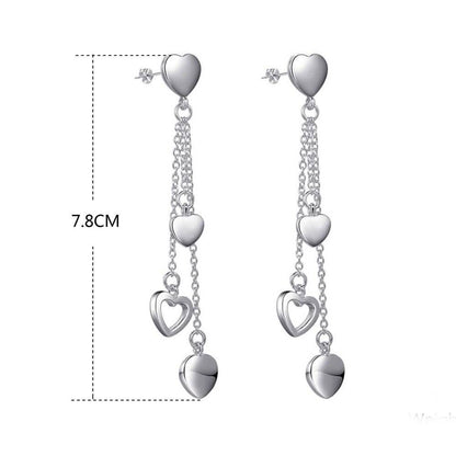 Long Dangling Heart Earrings in White Gold